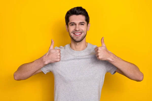 Photo Cool Brunet Millennial Guy Show Thumb Wear Grey Shirt — Stockfoto