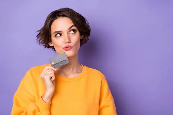 Portrait Attractive Minded Curious Girl Holding Bank Card Deciding Copy — Stockfoto