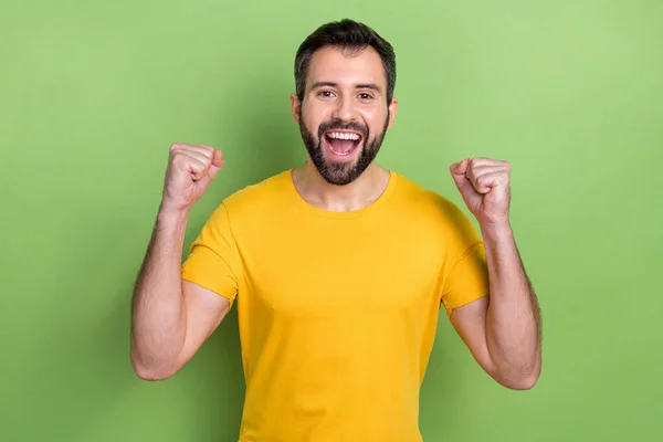 Portrait Overjoyed Delighted Man Raise Fists Triumph Accomplishment Isolated Green — Stok fotoğraf