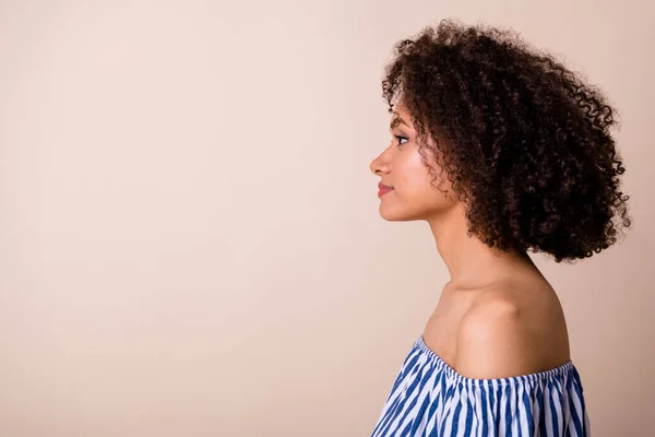 Profile portrait of pretty calm person look empty space blank isolated on pastel beige color background.