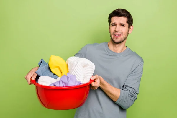 Photo Young Unhappy Brunet Guy Laundry Wear Shirt Isolated Green — Fotografia de Stock