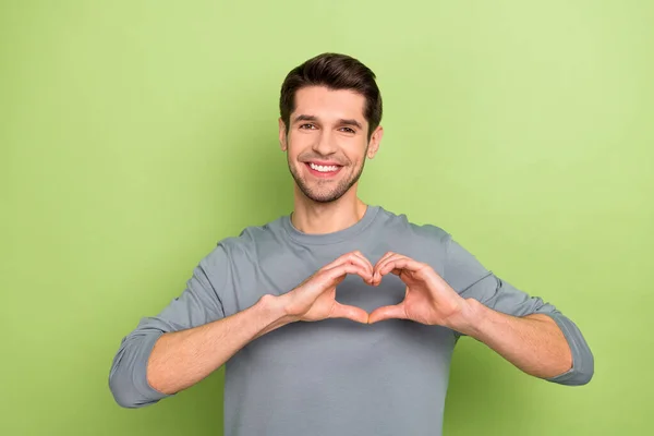 Photo Nice Millennial Brunet Guy Show Heart Wear Grey Shirt — Fotografia de Stock