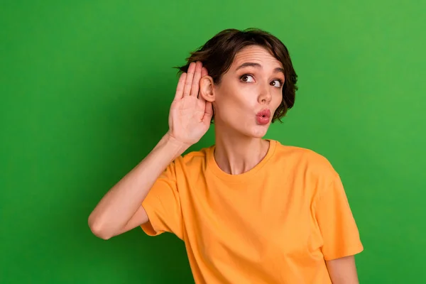 Photo Excited Pretty Young Woman Dressed Orange Shirt Arm Ear — Foto de Stock