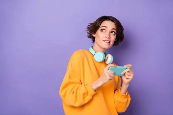 Portrait Minded Person Hold Telephone Look Interested Empty Space Bite — Stockfoto