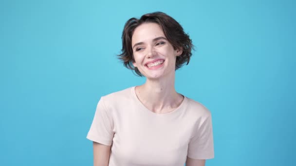 Nice Girlish Lady Smiling Camera Isolated Blue Color Background High — Stockvideo