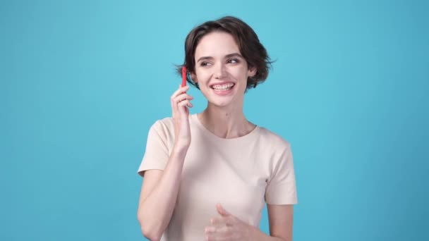 Lady Using Gadget Speaking Isolated Blue Color Background High Quality — Video Stock