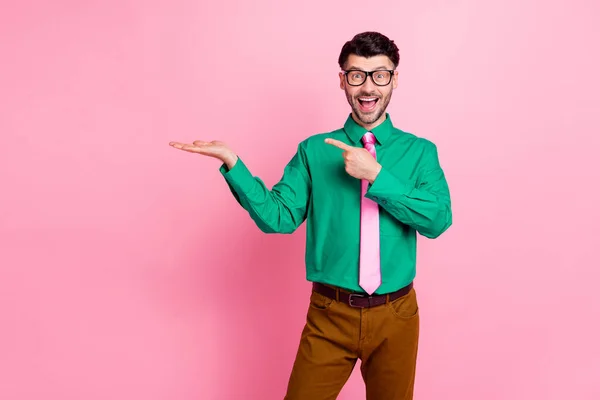 Portrait Young Smiling Guy Wear Green Shirt Hold Hand Promote — Fotografia de Stock