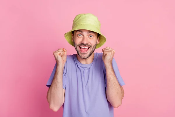 Photo Delighted Guy Raises Arm Fist Enjoy Rejoice Celebrate Luck — Zdjęcie stockowe