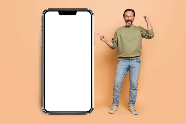 Full Size Photo Excited Delighted Man Direct Finger Empty Space — Stockfoto
