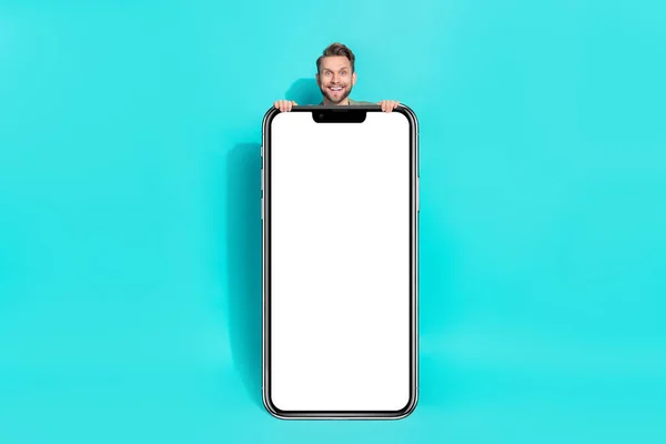 Photo of excited funky positive man sale reaction placard empty space wear pullover isolated blue color background.