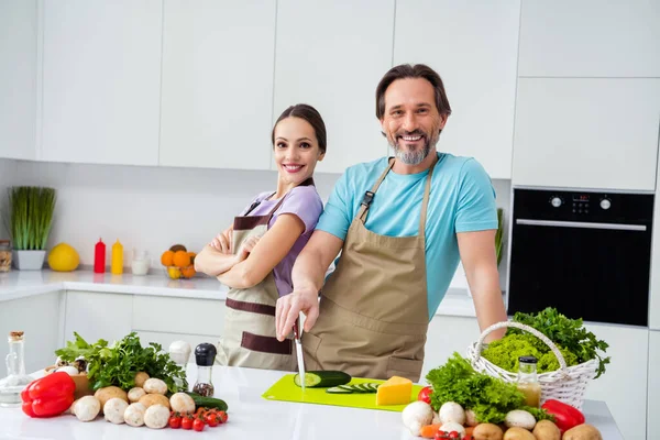 Portrait Two Positive Satisfied People Crossed Arms Chopping Fresh Cucumber — Stockfoto