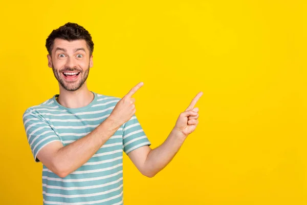 Portrait Photo Young Attractive Guy Excited Crazy Pointing Empty Space — Fotografia de Stock