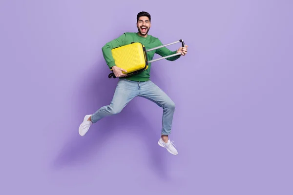 Full Length Photo Excited Latin Arab Guy Hold Yellow Baggage — Zdjęcie stockowe