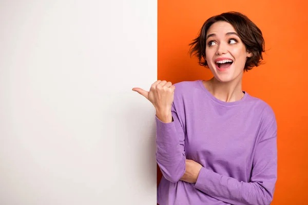 Photo Adorable Excited Girl Dressed Purple Pullover Pointing Thumb White — Stockfoto