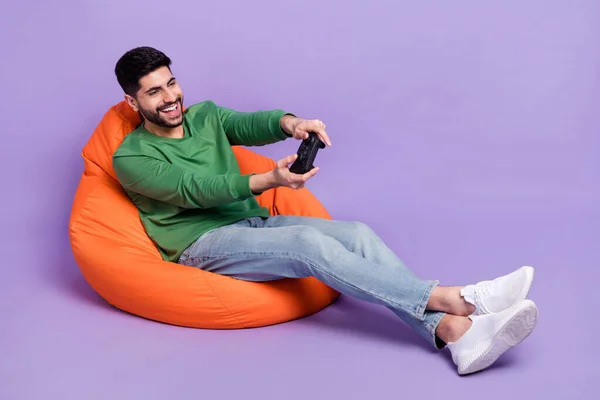 Full Size Photo Young Latin Man Sitting Cozy Beanbag Hold — Foto Stock