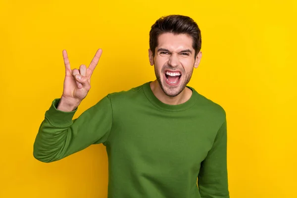 Photo Cool Funny Guy Wear Green Sweater Showing Hard Rock — Zdjęcie stockowe