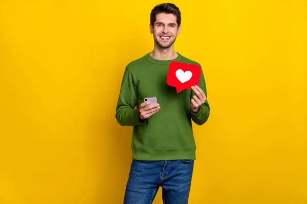 Photo Pretty Shiny Young Guy Dressed Green Pullover Holding Heart — Stockfoto