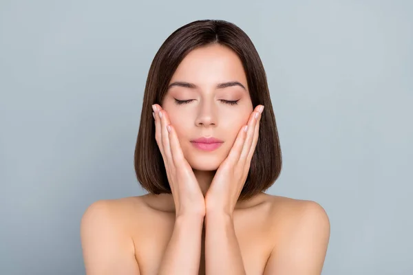 Portrait of aesthetic lady touch hands cheeks enjoy plastic surgery detox procedure ideal skin isolated over grey color background.