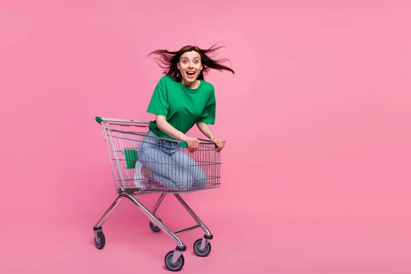 Full Length Portrait Cheerful Overjoyed Girl Sitting Supermarket Trolley Isolated — Fotografia de Stock