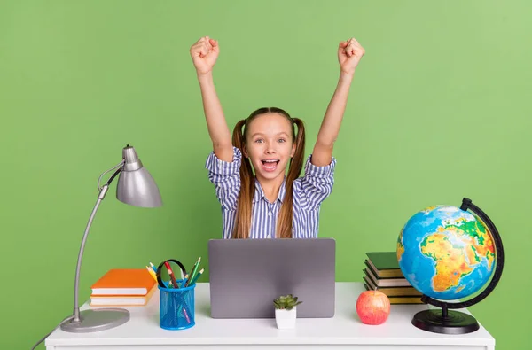 Photo Sweet Excited Little Schoolkid Wear Shirt Ponytails Sitting Desktop — Zdjęcie stockowe