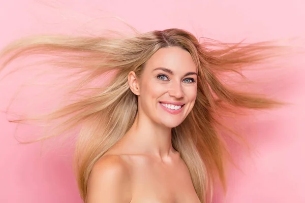 Photo of joyful lady have her hairstyle hairdo fly new anti dander shampoo aplly concept isolated over pink pastel color background.