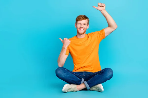 Full Length Photo Funny Cheerful Guy Dressed Orange Shirt Sitting — ストック写真