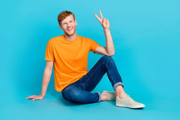 Full Length Photo Cheerful Funny Guy Dressed Orange Shirt Sitting — Stockfoto