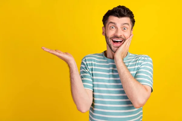 Photo Impressed Staring Handsome Guy Dressed Striped Shirt Showing Empty — Foto de Stock