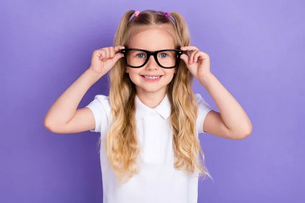 Photo Adorable Clever Schoolgirl Ponytails Arms Touch Specs Toothy Beaming — Stockfoto