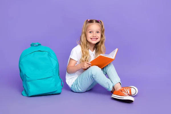 Full Size Photo Little Girl Ponytails Toothy Smile Read Textbook — Fotografia de Stock