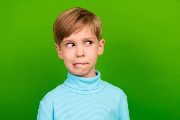 Photo Doubtful Unsure Small Son Wear Turquoise Turtleneck Biting Lip — Stockfoto