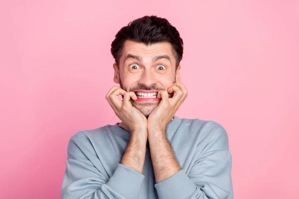 Portrait Impressed Terrified Man Biting Finger Nails Grinning Teeth Isolated — Stockfoto
