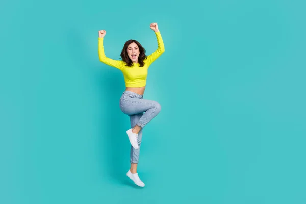 Full Size Photo Astonished Girl Jump Raise Fists Success Achieve — Stock fotografie