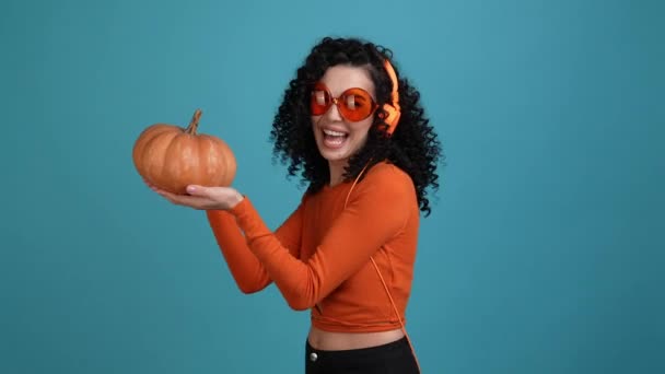 Lady Listen Headset Dance Pop Hold Pumpkin Isolated Blue Color — Vídeo de stock