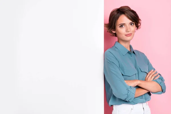 Photo of pretty adorable serious lady wear blue stylish outfit arm folded stand white empty space isolated on pink color background.