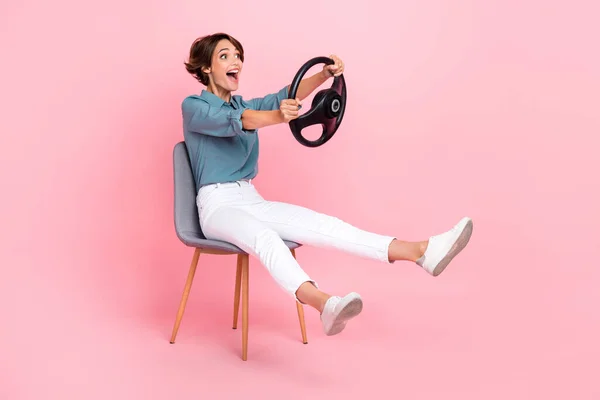 Photo of satisfied cheerful crazy lady look empty space enjoy new vehicle pass drive lesson exam course isolated on pink color background.