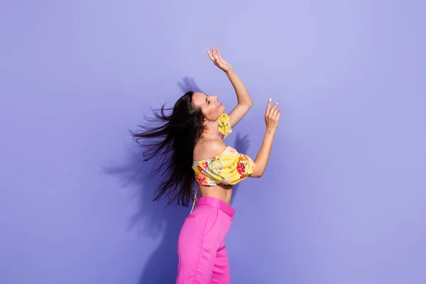 Profile photo of lovely adorable person dancing chilling flying hair isolated on violet color background.