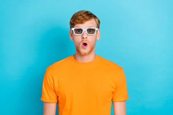 Photo of hooray ginger hair guy watch film wear orange t-shirt eyewear isolated on turquoise color background.