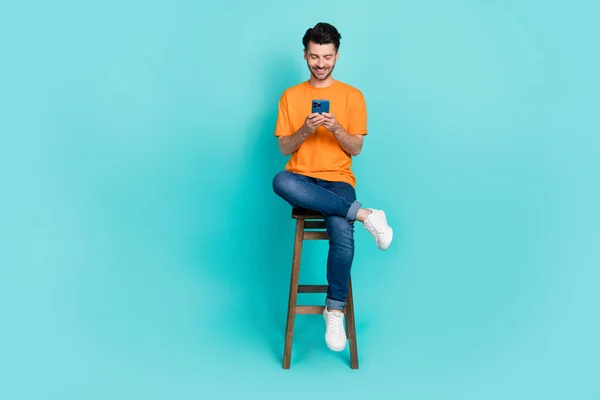 Full Length Photo Attractive Man Sit Stool Hold Phone Device — Zdjęcie stockowe