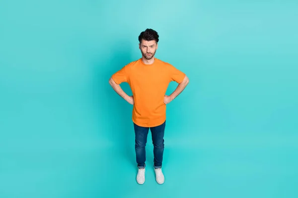 Full length photo top angle view of guy feel displeased about noisy neighbors isolated on cyan color background.