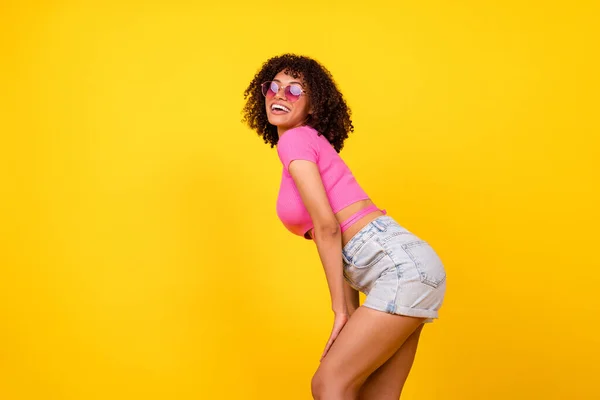 Profile portrait of stunning lovely lady toothy smile posing good mood isolated on yellow color background.