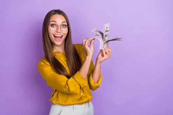 Photo of hooray millennial lady count money wear eyewear blouse isolated on violet color background.