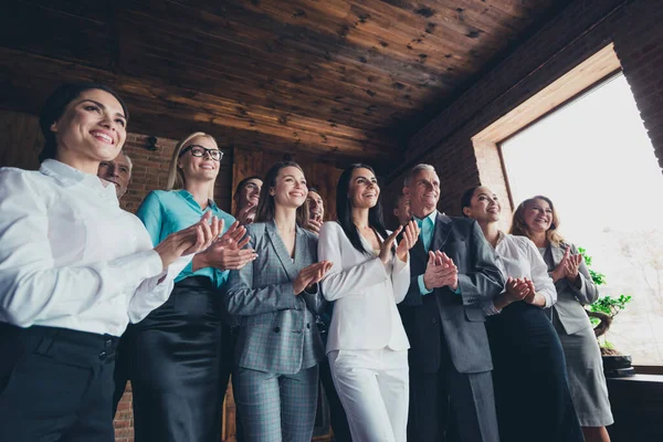 Photo of positive delighted business people standing conference room hands clapping modern office indoors.