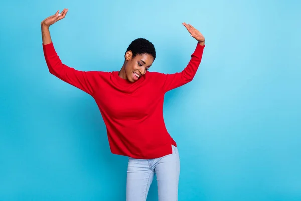 Photo of cool millennial lady dance wear red shirt isolated on blue color background.