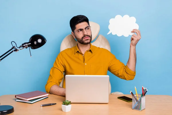 Photo of minded pensive person look interested empty space cloud card contemplate isolated on blue color background.