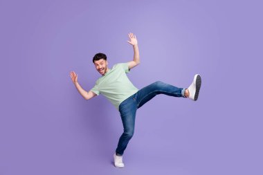 Full length photo of overjoyed excited wear stylish clothes denim man raise hand palm good mood isolated on purple color background. clipart