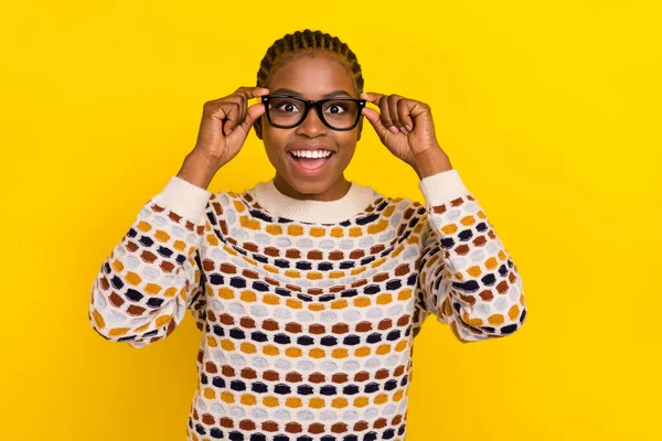 Portrait of nice crazy satisfied person girl arms touch eye accessory toothy white smile enjoy purchase isolated on yellow color background.