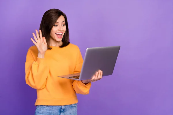 Photo of young attractive gorgeous nice lady wear stylish outfit hold computer excited speak online blog youtube blog hello isolated on purple color background.