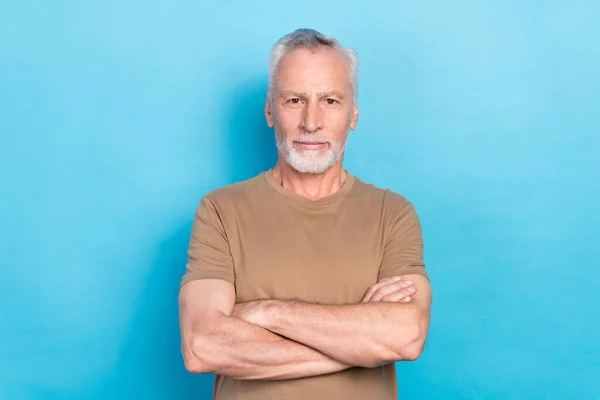 Photo of intelligent successful man arm folded dressed pastel stylish outfit clothes isolated on blue color background.