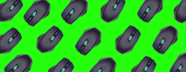 Wireless mouses, top view of wireless mouses isolated on green background. Computer equipments pattern background.